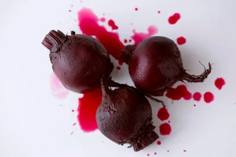 Three Whole Roasted Beets on White Stock Photos