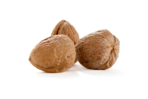 Three whole walnuts Stock Photos