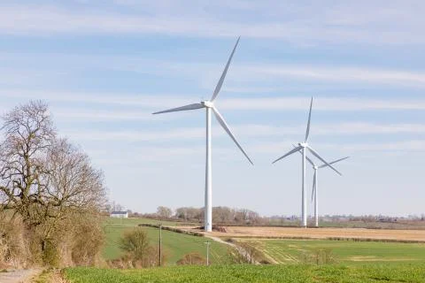 Three Wind Turbines in Fields Stock Photos