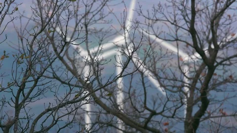 Three wind turbines with focus change Stock Footage 87546874