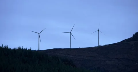Three wind turbines on mountain ridge Stock Footage 325957409