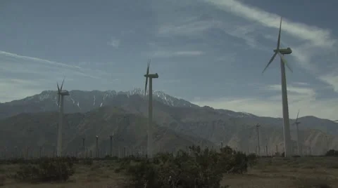 Three Wind Turbines With Mountains in The Background Stock-Footage 19163623