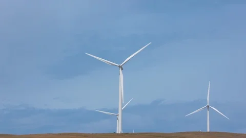 Three Wind Turbines Moving Together in the Wind Stock Footage 91879346