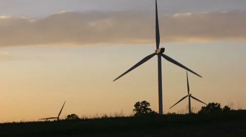 Three Wind Turbines in Silhouette Stock Footage 7745876