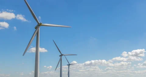 Three wind turbines time lapse Stock Footage