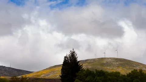 Three Wind Turbines on top of a hill, Lamas de Mouro, Portugal - Timelapse Stock Footage 129023787