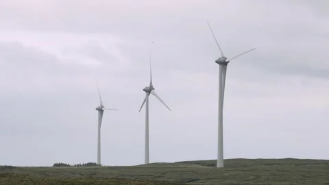 Three wind turbines turning in high winds Stock Footage 332155826