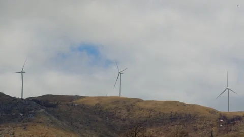 Three windmills on a hill Stock Footage 190039932