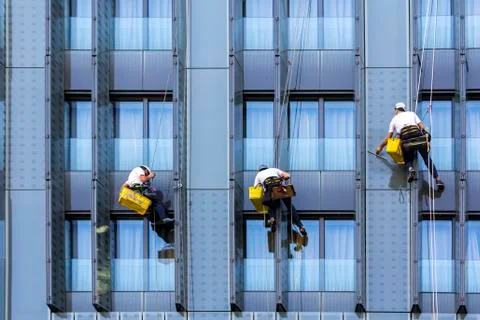 Three window washers Stock Photos