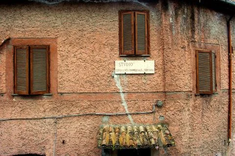 Three windows and a plate Stock Photos
