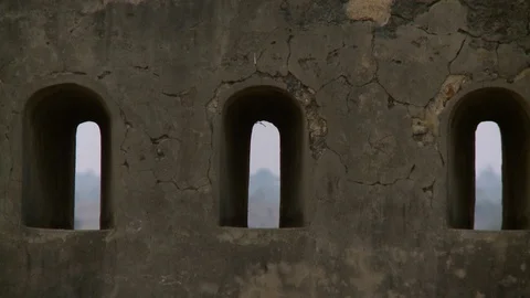 Three windows in a cracked wall Stock Footage 112670391