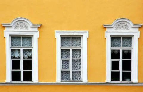 Three windows with curtains Stock Photos
