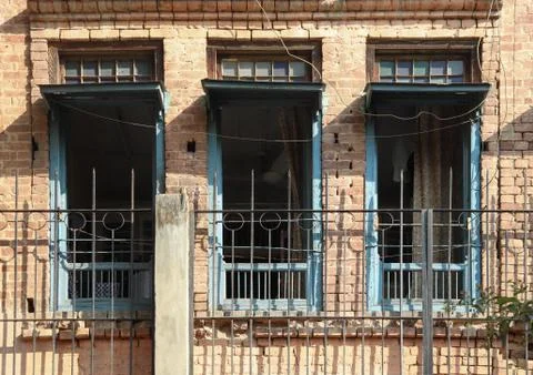 Three windows of old building opened Fotos de archivo