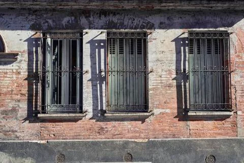 Three windows in a old building Stock Photos