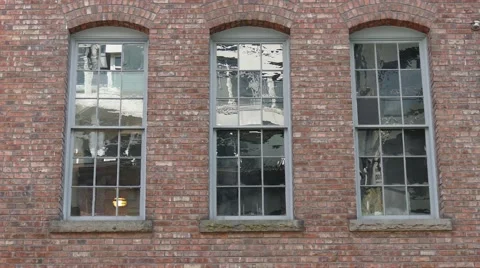 Three windows on the old English style brick building's wall. 動画素材 62763148