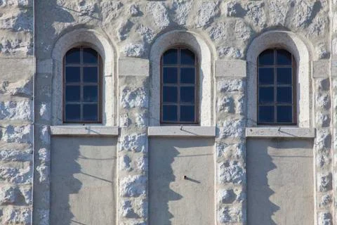 Three windows on wall Stock Photos