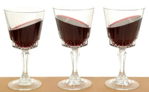 Three wineglasses and gravity Stock Photos