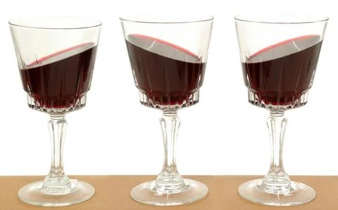 Three wineglasses and gravity Stock Photos