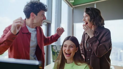 Three winners looking computer office closeup. Coworkers rejoicing achievement Stock Footage 319762764