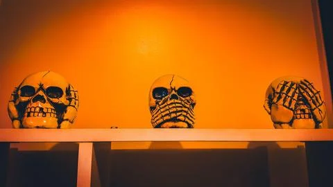 Three wise monkeys. Deaf, blind and mute monkey. In the shape of skulls. Skul Stock Photos