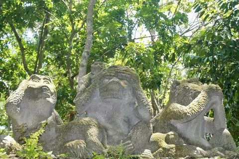 Three Wise Monkeys Stone Statues  Sacred Monkey Forest Ubud Bali Indonesia Stock Photos