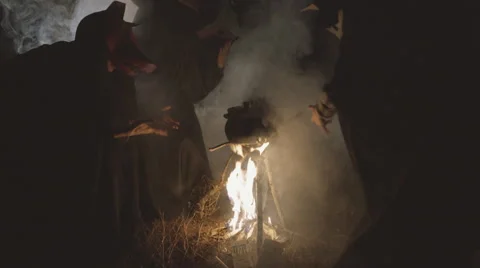 Three witches hexing by the fire. Видео 59346808