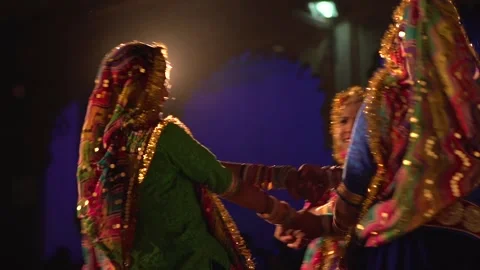 Three Women Dance in Circle Holding Hands in Udaipur, Rajasthan Stock Footage 344972448