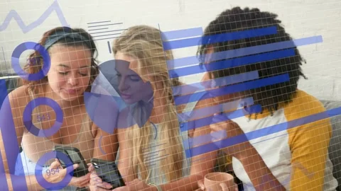 Three women on gray couch leaning in as center woman tapping phone, comparing Stock Footage 333774769