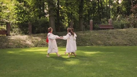 Three women in round dance roundelay. Girls wear Ancient ethno Ukrainian Stock Footage 233337853