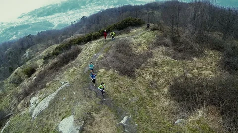 Three women running in single file to a dirt path Stock Footage 59732281