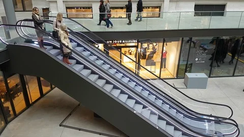 Three Women Standing On Going Down Escalator Video stock 100723280