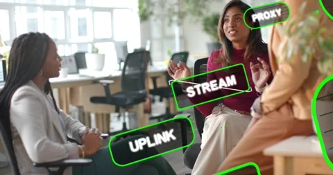 Three women talking in IT office, center speaking causing green UPLINK STREAM Stock Footage 334176340
