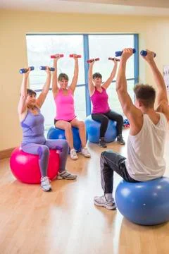 Three women using weights 스톡 사진