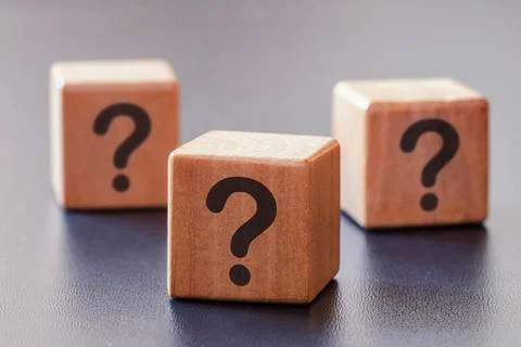 Three wooden blocks with question marks Stock Photos