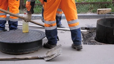 Three workers are taking shovels and are going to work. Stock Footage 108063065