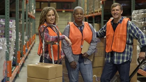 Three workers standing in a warehouse 스톡 동영상 83395648