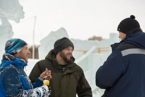Three workers talking on the construction site 스톡 사진