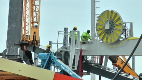 Three workers work at height on cranes in the port Stock Footage 232215297