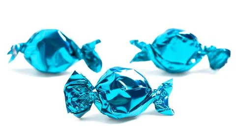 Three Wrapped Blue Candy Isolated on a White Background Foto stock