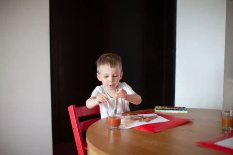 Three year old boy paint with watercolor at home. Stock Photos