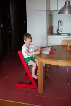 Three year old boy paint with watercolor at home. Stock Photos