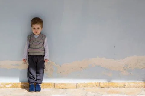 Three year old boy portrait on old wall Stock Photos
