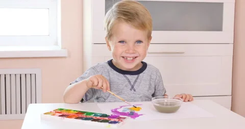 Three years old little boy painting Stock Footage 96212461