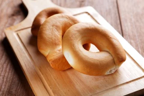 Three yellow bagels on a close-up table Stock Photos