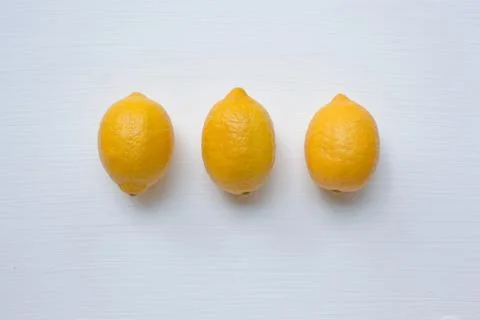 Three yellow lemons with on white. Stock Photos