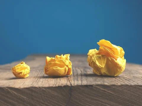 Three yellow paper balls on a table Stock Photos