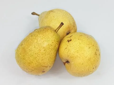 Three yellow pears on white background Stock Photos