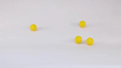 Three Yellow Pickleball Balls Falling and Bouncing on White Background 스톡 동영상 328065952