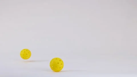 Three Yellow Pickleball Balls Falling and Bouncing on White Background 스톡 동영상 328266827
