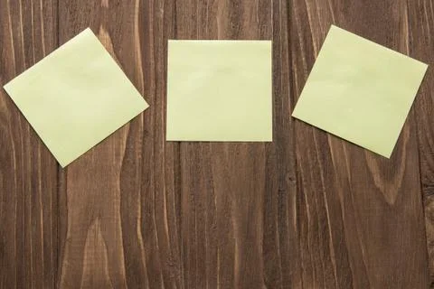 Three yellow post-in notes Stock Photos